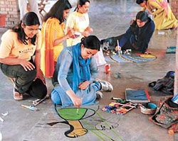 A student of the Government College of Art, Sector 10, puts her artistic skills to test in the floor-painting contest of �Renaissance II� on the college premises in Chandigarh on Monday.