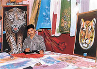 Rampal Sehota with his works at an exhibition.