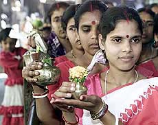 Women hold water pots