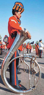 A member of one of the contesting brass bands wears an apprehensive look before blowing the trumpet at the third all-India police band competition being held at the CRPF Group Centre, Pinjore, on Wednesday.