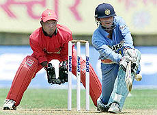 India's Mohammed Kaif sweeps a delivery