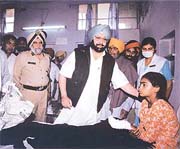 The Chief Minister, Capt Amarinder Singh, talks to injured patients 