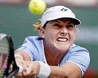 Monica Seles returns a shot to Arantxa Sanchez-Vicario of Spain 