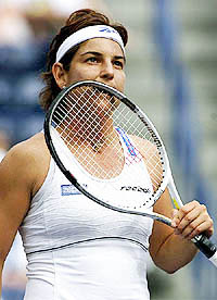 Arantxa Sanchez-Vicario of Spain bites her racquet after losing a point in her match against Monica Seles 