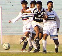Indian Nationals (in black and white jersey) and the Allwyn Hindustan (in white), battling it out for supremacy in the final of the DSA Senior Division Championship at the Ambedkar Stadium in the Capital on Friday. 