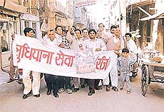 Members of the Ludhiana Sewa Sangh participate in kirtan march in Ludhiana on Friday. 