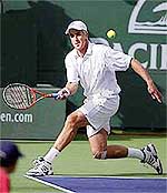 Todd Martin returns a shot