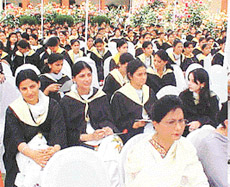 Students of the Guru Nanak Khalsa College for Women await their turn to get degrees at the annual convocation function of the college in Ludhiana on Sunday.