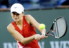 Daniela Hantuchova of Slovakia returns a shot