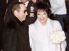 Liza Minnelli screams after throwing her bouquet into a crowd of onlookers as she and new husband , David Gest, leave the Marble Collegiate Church in New York City after their wedding on Saturday night.