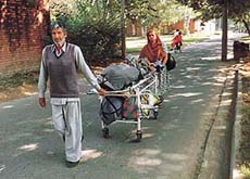 Relatives ferry their patient from the main hospital, PGI, to Rotary Sarai. 