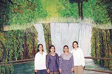 Standing in front of the 15�x23� backdrop of MCM DAV College stage, Sector 36, are Shaveta Vashist, Reena Aneja, Preet Sangra and Pooja Sharma.