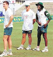 Zimbabwe�s bowlers Heath Streak (C) and Pommy Mbangwa (R) during their net practice on the eve of the last and final one-day international match against India at Nehru Stadium in Guwahati on Monday.