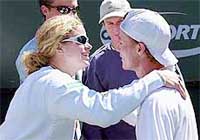 Lleyton Hewitt of Australia prepares to kiss his girlfriend