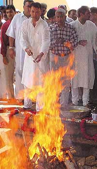 Jagat Singh, husband of Natasha Singh, lights her funeral pyre