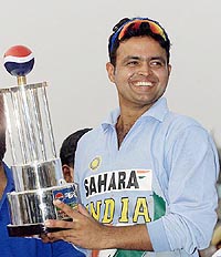 Indian batsman Dinesh Mongia holds his man of the series trophy