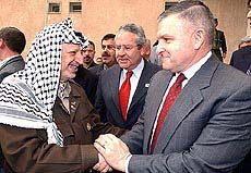 Palestinian President Yasser Arafat (L) meets with US West Asia envoy Anthony Zinni 