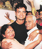 Cricketer Dinesh Mongia with his parents at his residence in Chandigarh on Wednesday night.