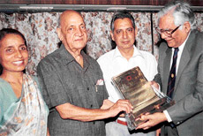 Dr R.P. Bambah, former Vice-Chancellor, PU, felicitates Dr G.P. Sharma for receiving the life time achievement award by the Zoological Society of India.