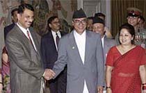 Nepal's Prime Minister Sher Bahadur Deuba and his wife Arzu Deuba meet India's Commerce Minister