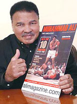 Boxing legend Muhammad Ali poses with a copy of a new magazine that chronicles his life and career in the ring in Beverly Hills.