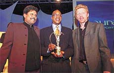 Former Indian cricket captain Kapil Dev with legendary 400 m hurdles world and Olympic champion Edwin Moses and German tennis star Boris Becker 