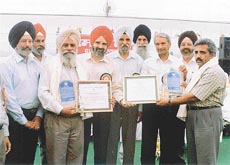 Mr Nek Singh and Mr Aman Behl, progressive farmers, who were given the Dalip Singh Dhaliwal memorial awards at the Kisan Mela in Ludhiana.