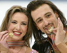 Irina Lobacheva and Ilia Averbukh of Russia show their gold medals