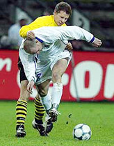 Borussia Dortmund's Christian Woerns (back) tackles Slovan Liberec's Jiri Stajner during their UEFA Cup quarter final