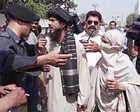 Pakistani police stop Sheikh Aslam and his mother, the brother and mother of Sheikh Adil