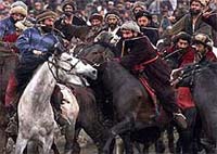 Afghan horsemen fight over possession of a headless goat