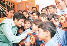 Supercop Mrs Kiran Bedi with achievers of DAV Public School, Sector-15, at the annual function of the school held at DAV College, Sector-10, in Chandigarh on Saturday.