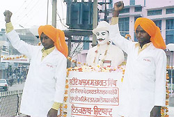 Members of an NGO shout patriotic slogans 