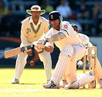England's batsman Graham Thorpe sweeps the ball