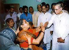 Minister of State for Home I. D. Swami consoles