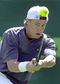 Lleyton Hewitt of Australia returns a shot