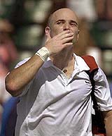 Andre Agassi blows a kiss into a crowd after defeating Agustin Calleri of Argentina in the Nasdaq-100 Open on Sunday in Key Biscayne, Florida. 