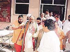 Godman Chandraswamy leaves a private hospital in Ludhiana on Tuesday. He was admitted to the hospital after he complained of breathlessness.