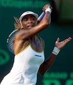 Venus Williams of the U.S. watches her return 