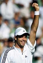 Fernando Gonzalez of Chile celebrates his upset win over Pete Sampras