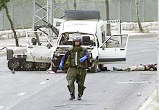 Israeli police sappers check a car