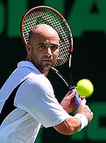 Andre Agassi of the USA eyes down a return from Thomas Johansson of Sweden in the first set of their fourth round match at the Nasdaq-100 Open in Key Biscayne, Florida, on Tuesday.
