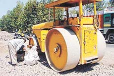 Labourers look at the place on the Panchkula-Kalka Highway