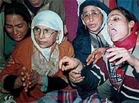 Wailing relatives of a Power Development Department employee, who was killed