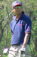 Feroz Ali watches the ball after the tee-shot 