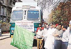 The Minister of State for Printing and Stationery, Mr Rakesh Pandey, flags off relief trucks for the riot victims in Gujarat in Ludhiana on Saturday.