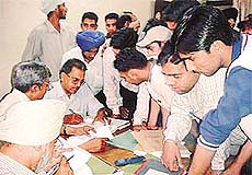 Non-teaching staff of Arya College collect fine from students who are short in lectures.