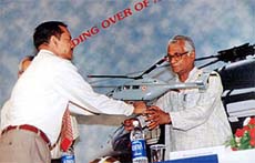 HAL chairman N. R. Mohanty handing over a model of advanced light helicopter