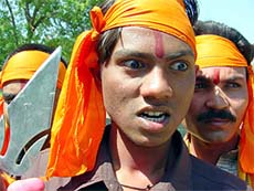 Bajrang Dal activists shout slogans during a protest rally