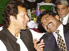 Imran Khan and Javed Miandad chat at a reception